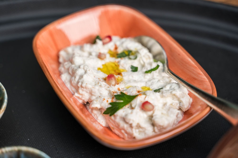 Creamy yogurt dip with pomegranate and herbs