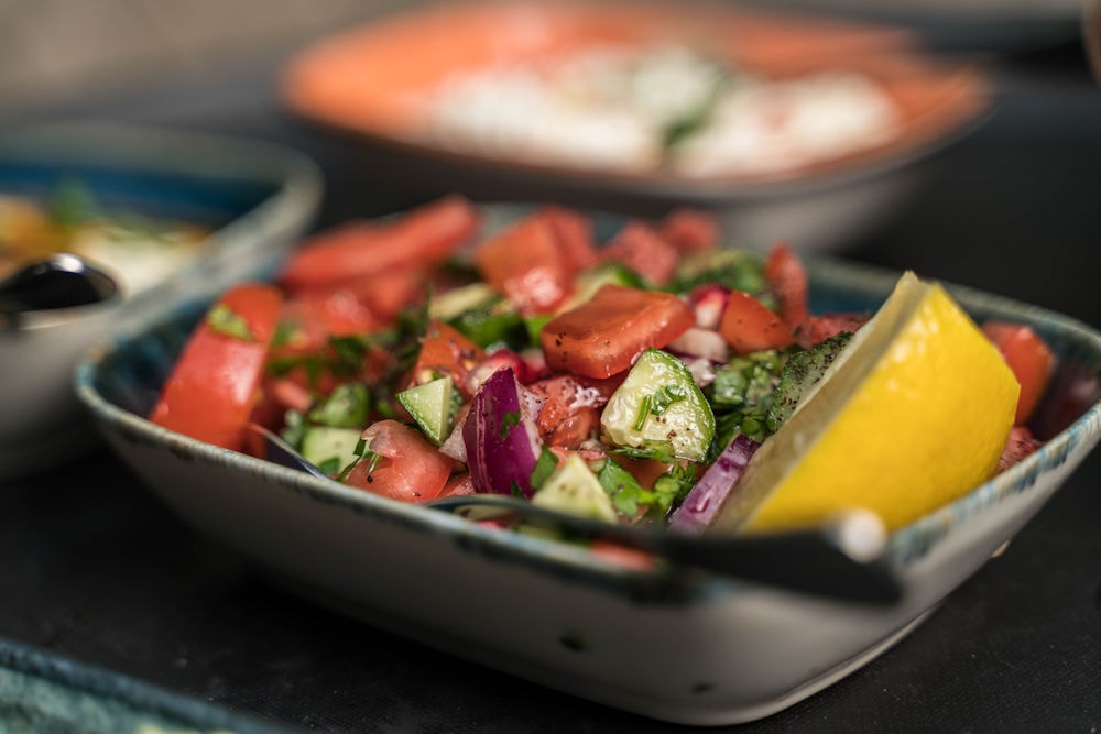 Fresh tomato and cucumber salad with lemon