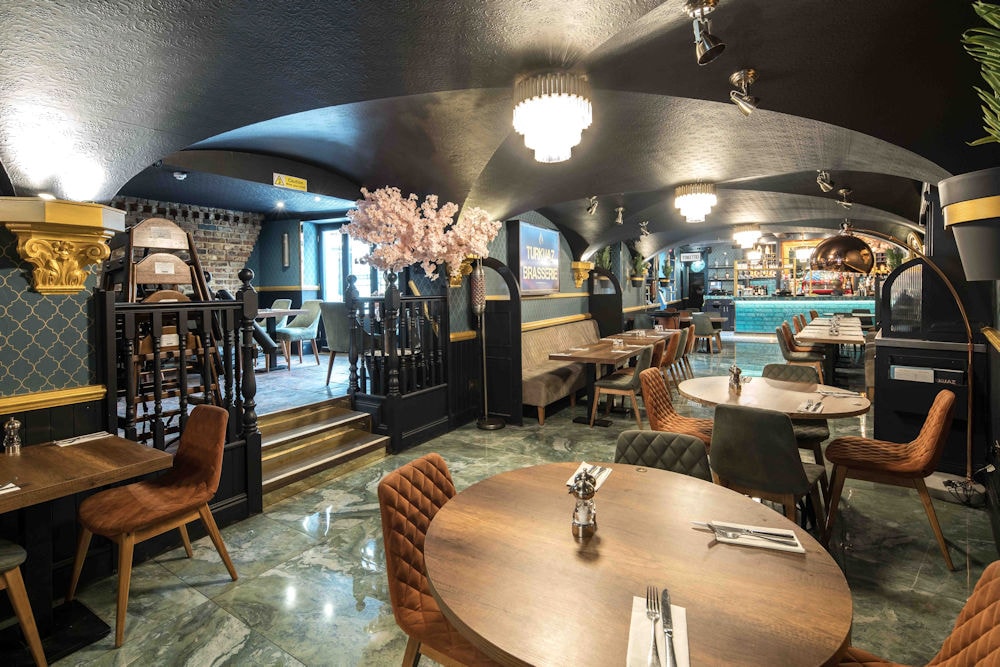 Turkuaz Brasserie vaulted dining room with gold accents