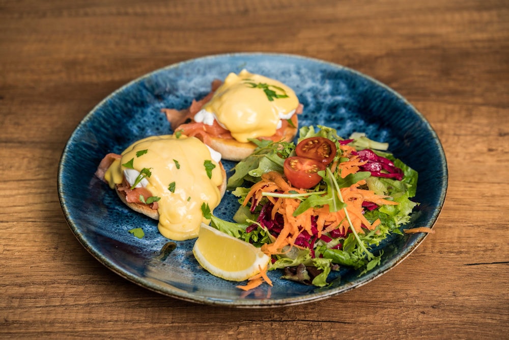 Eggs Benedict with smoked salmon and fresh salad