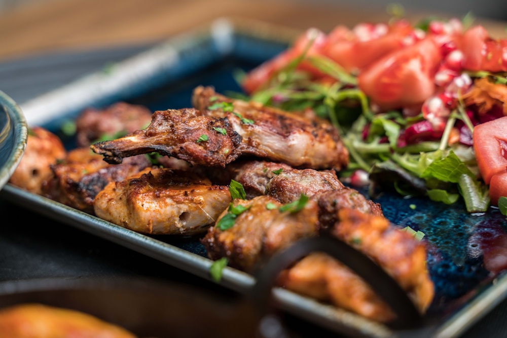 Grilled chicken wings with pomegranate salad