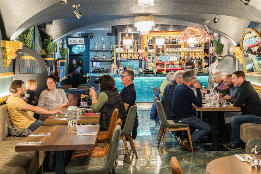 Guests dining inside Turkuaz Brasserie